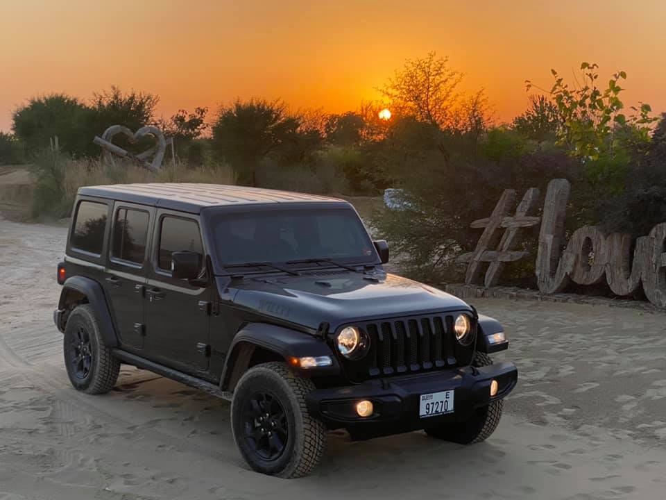 Jeep at sunset in the desert